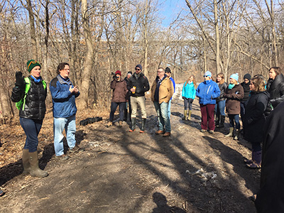 The MNRRA collaborators exploring an urban floodplain forest in the City of Saint Paul, MN